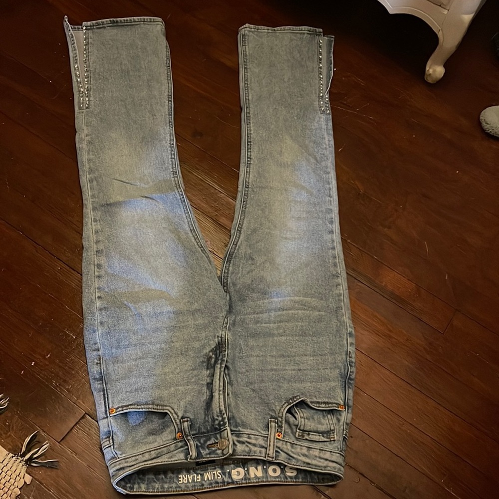 slim flare jeans with rhinestone and slits at the bottom
